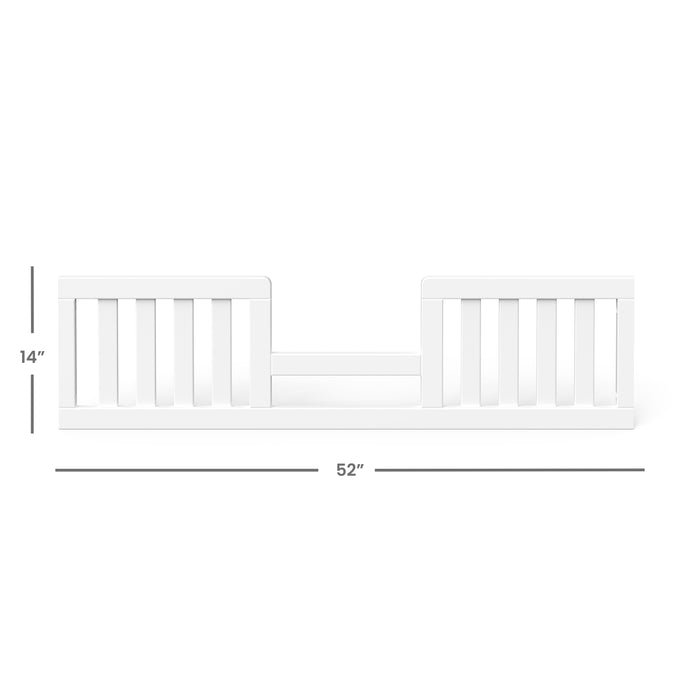 The Child Craft F09544 Toddler Guard Rail in matte white features vertical slats, measures 14" high by 52" wide, and uses non-toxic baby-safe finishes. Designed to attach to the side of a bed to help prevent toddler falls.