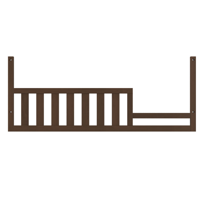 The Child Craft F09554 Toddler Guard Rail in Toasted Chestnut features vertical slats on the left and an open section on the right, designed to attach securely to a Child Craft crib for safe toddler bed conversion.