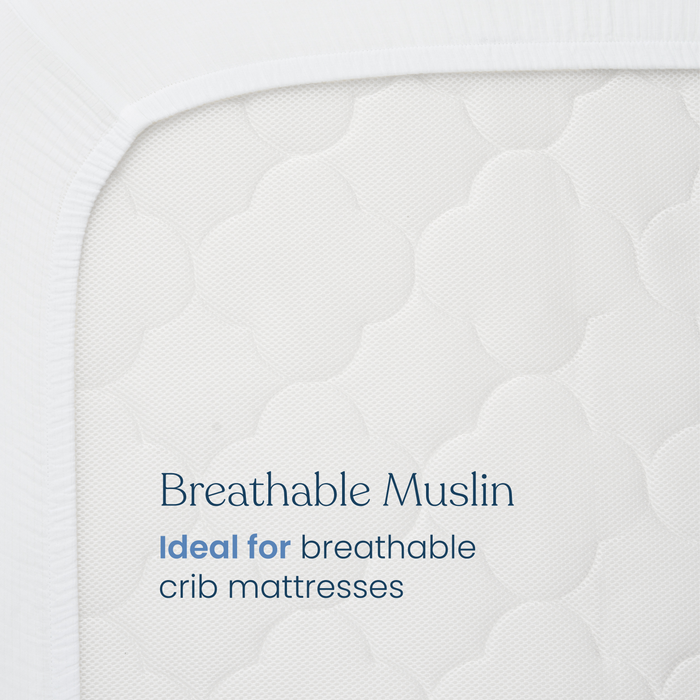 Close-up of a white, textured crib mattress with "Breathable Muslin" text. HALO Fitted Crib Sheets 100% Organic Cotton Muslin 2 Pack pairs perfectly for extra comfort. Ideal for breathable mattresses; text in blue and gray.