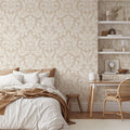 Floral Dreams Damask Wallpaper in Cream on Sand shown in a bedroom