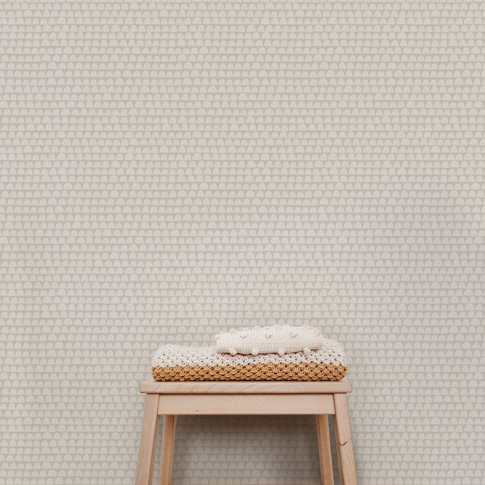 The Freehand Arches Wallpaper in Gray adds visual interest and a touch of whimsy to any room. The elegant curved motif creates a sense of depth and texture that can be appreciated from any angle, while the beige hue evokes a sense of calm and refinement.