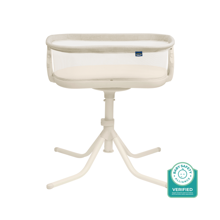 The HALO® BassiNest® Swivel Sleeper 4.0 Signature is a white bassinet with mesh sides on a four-legged stand. Featuring the Baby Safety Alliance Verified badge, it’s an ideal bedside sleeper for your baby.
