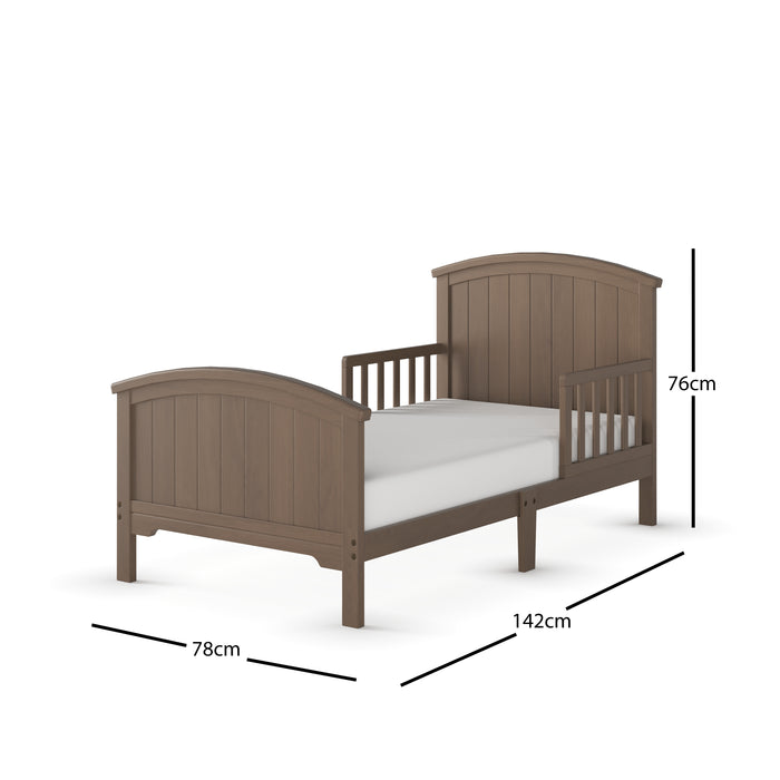 The Child Craft Hampton Toddler Bed in Dusty Heather features a high headboard and footboard, partial side rails, and measures 76 cm high, 142 cm long, and 78 cm wide.