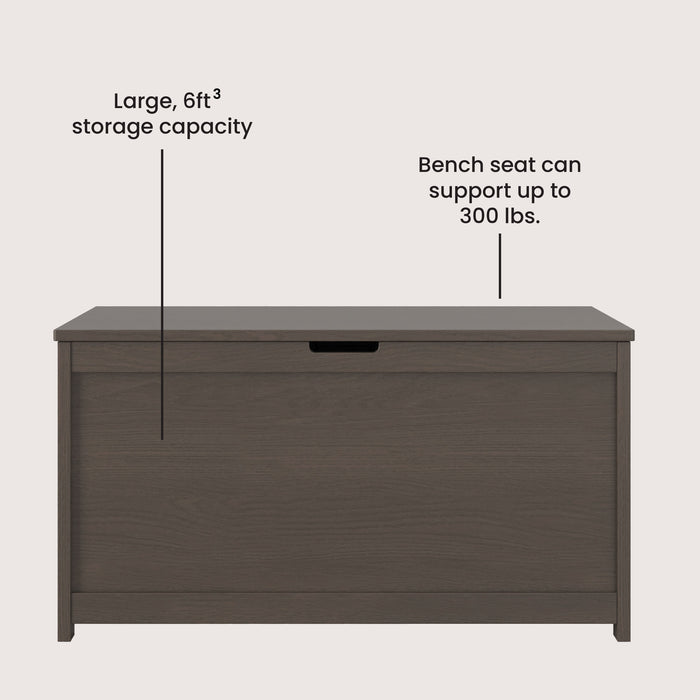 The Child Craft Harmony 33" Kids Toy Box in Dapper Gray features a flat lid, offers a spacious 6 cu. ft. storage capacity, and its bench seat supports up to 300 lbs. Shown on a plain light-colored background.