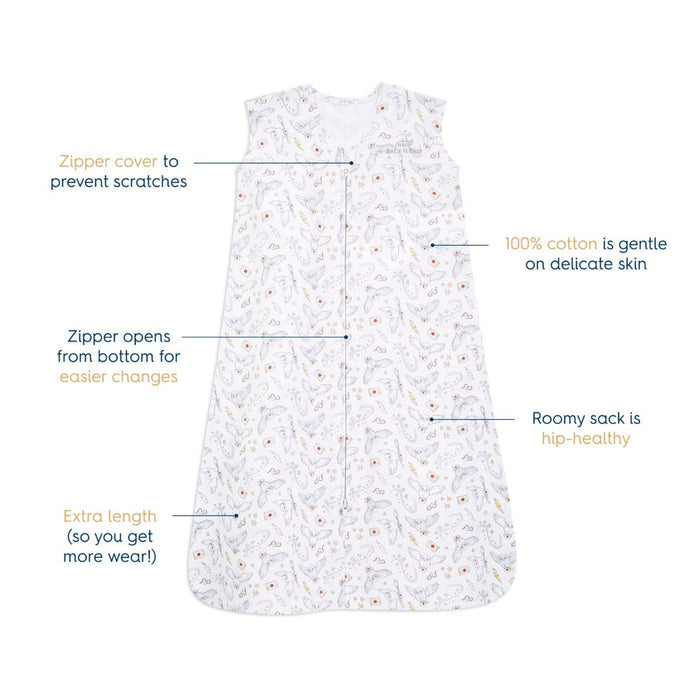 The HALO Harry Potter™ Wearable Blanket, 100% cotton with TOG 0.5, features a zipper cover and bottom-up zipper for easy access. This sleeveless design includes extra length and a roomy hip-healthy sack, adorned with colorful illustrations on white fabric.