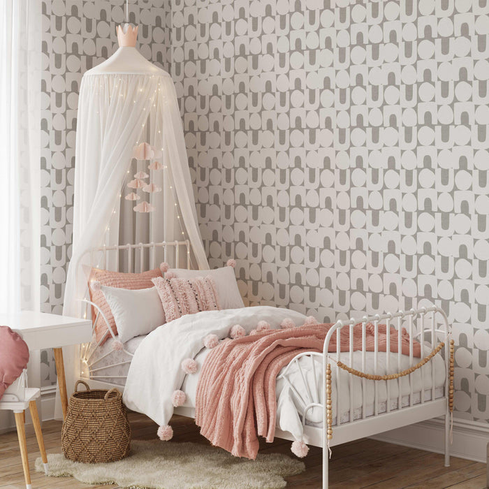 Modern Spheres and Arches Wallpaper in Gray shown in a girls bedroom