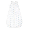 The aden + anais organic cotton light sleep sack TOG 1.0 is a sleeveless, white baby sleeping bag crafted from 100% organic cotton muslin with a front zipper. Featuring light blue elephants, it offers a cozy and breathable design for infants and is GOTS certified for safe and comfortable sleep.