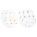 The aden + anais organic cotton muslin burpy bibs 2 pack includes two GOTS certified white cloths: one with a blue cloud pattern and the other with grey and beige elephants, both designed with a curved shape for shoulder draping.