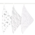 Three aden + anais organic cotton muslin oversized washcloths in white hang on a rod: the first with gray animal and star patterns, the second with gray circles, and the third with subtle starry dots. These stylish, eco-friendly washcloths ensure your little ones comfort.