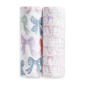 The aden + anais organic cotton muslin swaddle blanket 2 pack includes two blankets: one featuring large pastel bows and the other with a pattern of small pink bows.