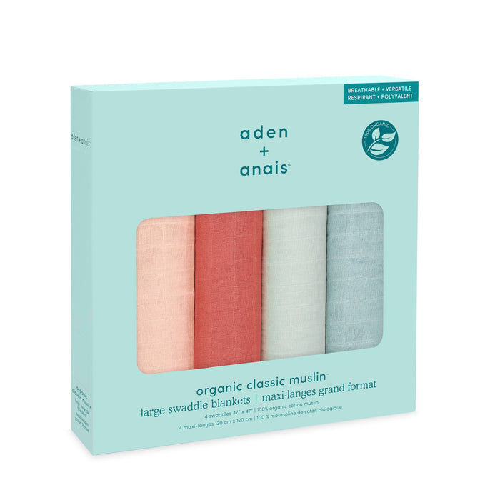 A set of aden + anais organic cotton muslin swaddle blankets includes four breathable, versatile GOTS-certified blankets in pink, white, peach, and mint shades.