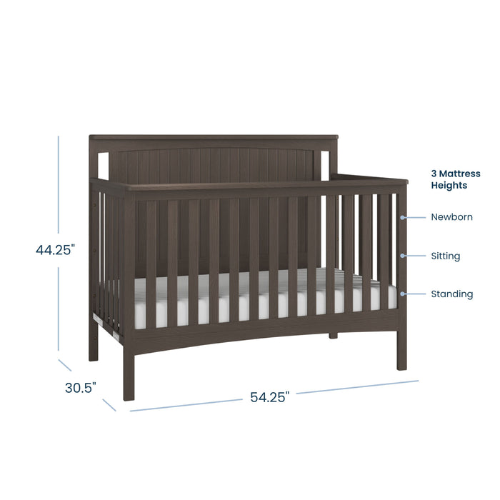 The Child Craft Scout 4-in-1 Convertible Crib in Dapper Gray features slatted sides and back, adjustable to 3 mattress heights (newborn, sitting, standing), and measures 44.25"H x 30.5"D x 54.25"W for versatile nursery use.