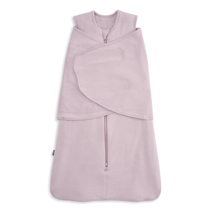 The HALO Swaddle SuperSoft Bamboo TOG 2.0 is a light purple sleep sack and swaddle with a front zipper and adjustable wings, made from soft bamboo fabric to keep your baby cozy and comfortable.