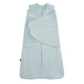 The HALO Swaddle SuperSoft Bamboo TOG 2.0 features a light blue design with a front zipper and adjustable Velcro wings, keeping infants snug and secure while sleeping.