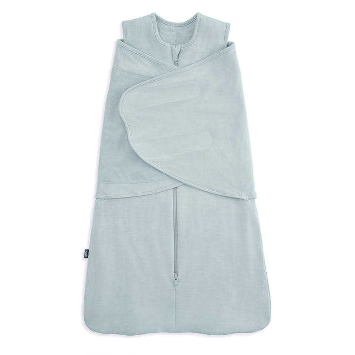 The HALO Swaddle SuperSoft Bamboo TOG 2.0 features a light blue design with a front zipper and adjustable Velcro wings, keeping infants snug and secure while sleeping.