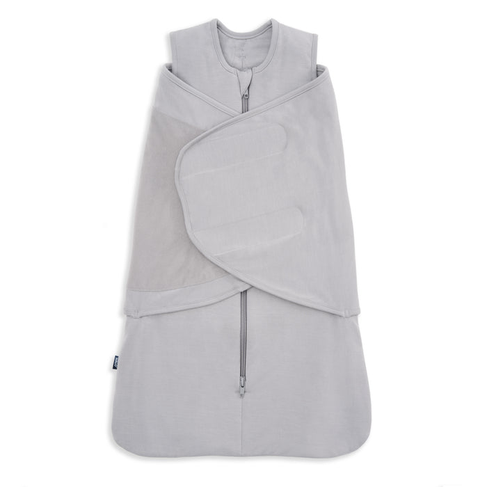 A light gray HALO SuperSoft Bamboo Swaddle TOG 2.0, featuring a zippered front and adjustable Velcro wings, made from soft bamboo fabric, is shown laid flat on a white background.