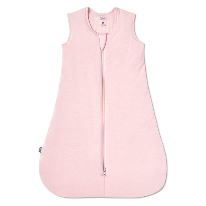 The HALO SuperSoft Bamboo Wearable Blanket TOG 1.5 is a sleeveless, light pink baby sleep sack with buttery bamboo fabric, a 3-layer design, and a front zipper from neckline to hem, shown laid flat on a white background.