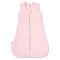 The HALO SuperSoft Bamboo Wearable Blanket TOG 1.5 is a sleeveless, light pink baby sleep sack with buttery bamboo fabric, a 3-layer design, and a front zipper from neckline to hem, shown laid flat on a white background.