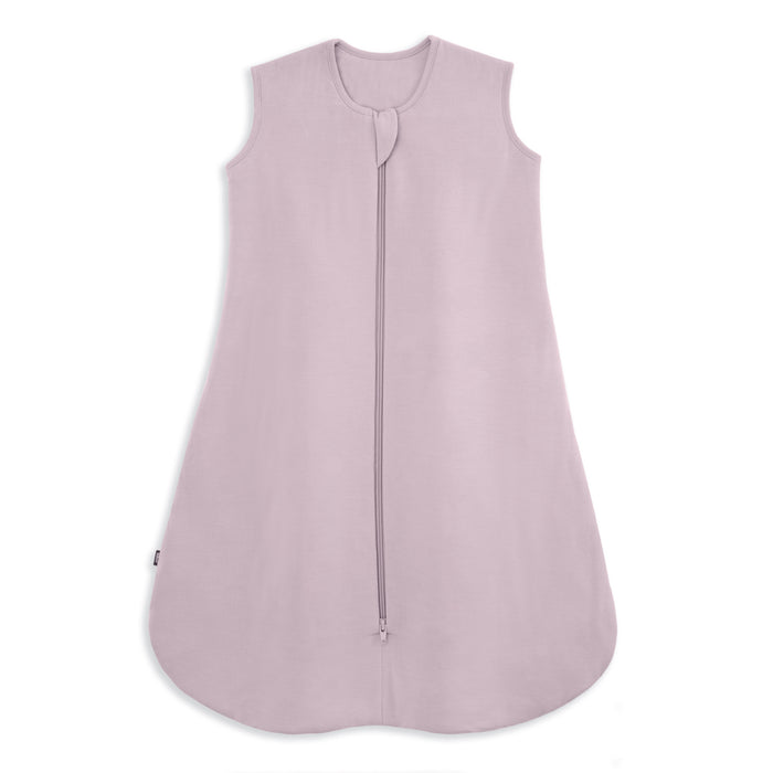 The HALO SuperSoft Bamboo Wearable Blanket TOG 1.5 is a sleeveless, light lavender baby sleep sack made from buttery bamboo with a 3-layer design and front zipper from neck to bottom, shown on a white background.