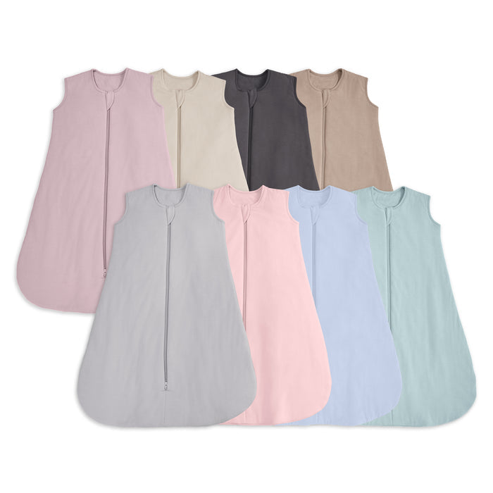 Eight HALO SuperSoft Bamboo Wearable Blanket TOG 1.5 sleep sacks in pink, cream, dark gray, beige, gray, light pink, light blue, and light green are arranged in two rows. Each sleeveless sack features a handy 2-way zipper for easy changes.