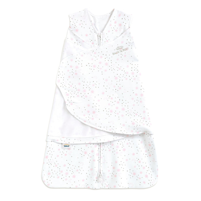 The HALO Swaddle 100% Cotton TOG 1.5 is a white infant sleep sack with a pink and gray star pattern, adjustable wings, sleeveless design, Velcro wrap, and front zipper for healthy hip development and a cozy sleeping environment.