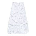 The HALO Swaddle 100% Cotton TOG 1.5 is a white swaddle featuring blue star and moon patterns. It includes adjustable Velcro wings and a front zipper for easy access. Made from soft, breathable fabric, it supports healthy hip development for safe and comfortable sleep.