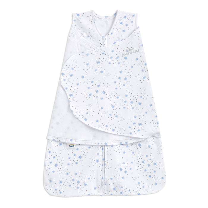 The HALO Swaddle 100% Cotton TOG 1.5 is a white swaddle featuring blue star and moon patterns. It includes adjustable Velcro wings and a front zipper for easy access. Made from soft, breathable fabric, it supports healthy hip development for safe and comfortable sleep.