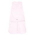 The HALO Swaddle 100% Cotton TOG 1.5 is a soft pink sleeveless baby wearable blanket, with adjustable fasteners and a bottom zipper for easy access, featuring a versatile 3-in-1 design for comfort.