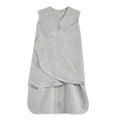 The HALO Swaddle 100% Cotton TOG 1.5 in gray has a double front zipper and adjustable Velcro wings for customizable swaddling, promoting healthy hip development. Its soft fabric keeps infants cozy.