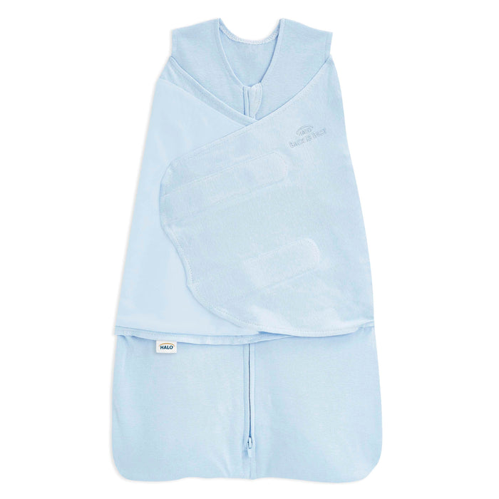 The HALO Swaddle 100% Organic Cotton TOG 1.5 in light blue features a bottom zipper and adjustable Velcro wings to keep infants cozy and secure.
