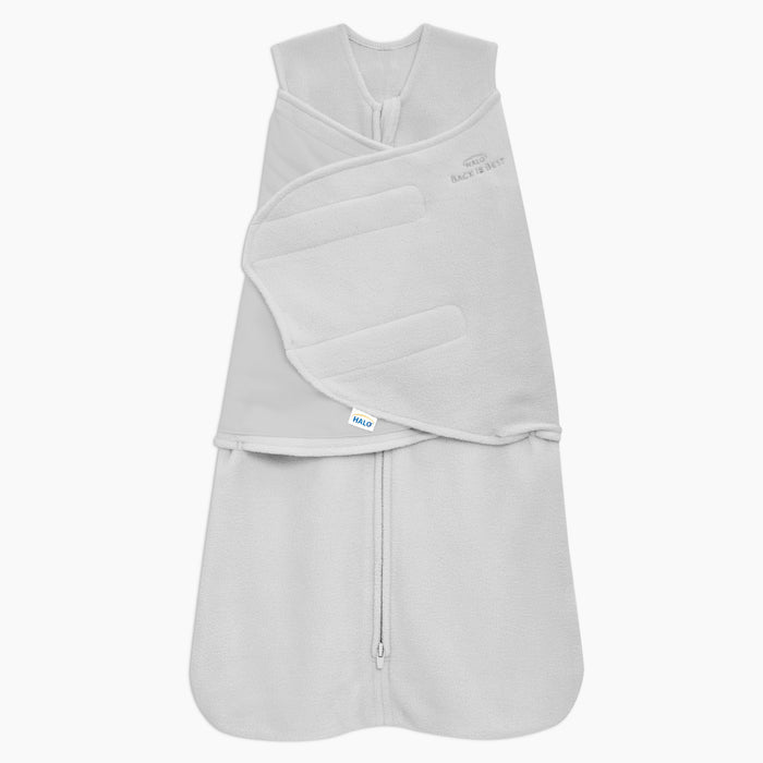 The HALO Swaddle Micro-Fleece TOG 3.0 in light gray, featuring adjustable swaddle wings, a bottom zipper, and soft fleece texture, is shown against a white background.