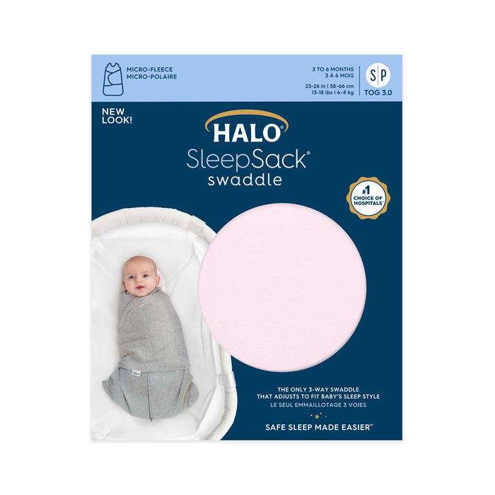 Packaging for HALOs Swaddle Micro-Fleece TOG 3.0, perfect for 3-6 month olds, size SP. It features a baby in a gray swaddle with blue text about its 3-in-1 design and hip health benefits, plus a large pink circle showing the fabric.