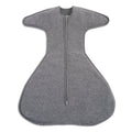 A gray, soft, ergonomic HALO SwaddleStretch™ Newborn Swaddle TOG 0.5 features wide arms, a flared hip-healthy bottom, and a central zipper running from neckline to base.