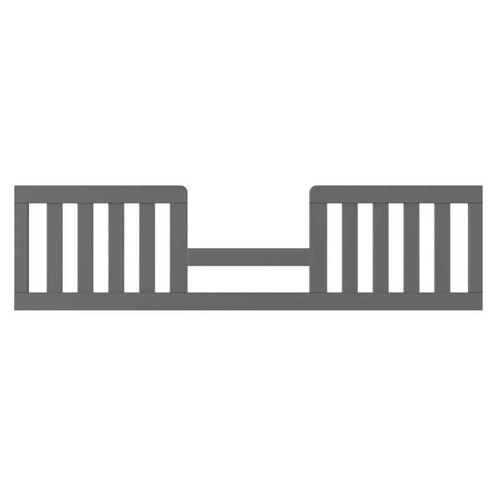The Child Craft Toddler Guard Rail in Cool Gray features vertical slats and an open middle section, designed to attach to a bed for added safety.
