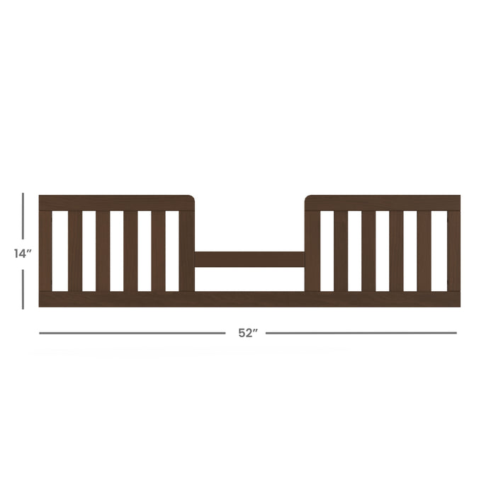 The Child Craft Toddler Guard Rail in Toasted Chestnut features dark wood with vertical slats, a lower center section, baby-safe finishes, and measures 14" tall by 52" wide for added peace of mind.