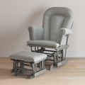 The Child Craft Tranquil Nursery Glider Cushion and matching ottoman feature padded seats and sturdy wooden bases with smooth gliding, shown in gray on a light wood floor against a beige wall.