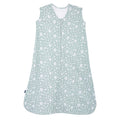 The HALO Wearable Blanket 100% Cotton TOG 0.5 is sleeveless and has a front zipper. In soft green with a white floral and animal pattern, it ensures safe sleep for your little one.
