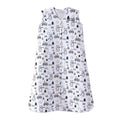 The HALO Wearable Blanket 100% Cotton TOG 0.5 is a sleeveless white sleep sack with a front zipper, featuring an adorable black-and-white animal pattern of penguins, bears, and trees, accented with small orange and blue dots to promote safe sleep for your little one.