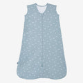 The HALO Wearable Blanket is a sleeveless blue 100% cotton sleep sack with TOG 0.5, featuring a front zipper and small white whale patterns for safe sleep.