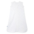 A sleeveless white HALO Wearable Blanket 100% Cotton TOG 0.5 features a subtle print of tiny grey leaves. It ensures safe sleep with a convenient front zipper and has a label on the left side, laid flat against a plain background.