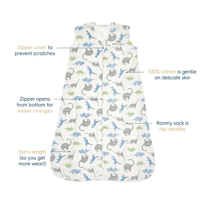 The HALO Wearable Blanket 100% Cotton TOG 0.5 features a dinosaur print and a safe sleep zipper cover, offering extra length and roomy fit. Its made from breathable cotton with a hip-healthy design for easy changing and extended wear, including a bottom-opening zipper.