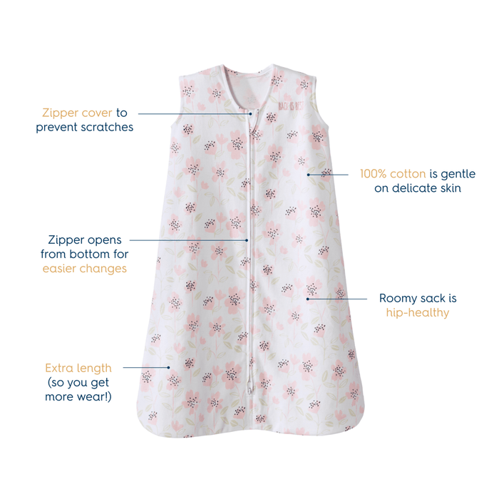 The HALO Wearable Blanket 100% Cotton TOG 0.5 is a sleeveless floral-patterned sleeping sack that promotes safe sleep. It features a zipper cover, bottom-opening zipper, extra length for growth, and a roomy design for hip health, all crafted from 100% cotton for delicate skin.