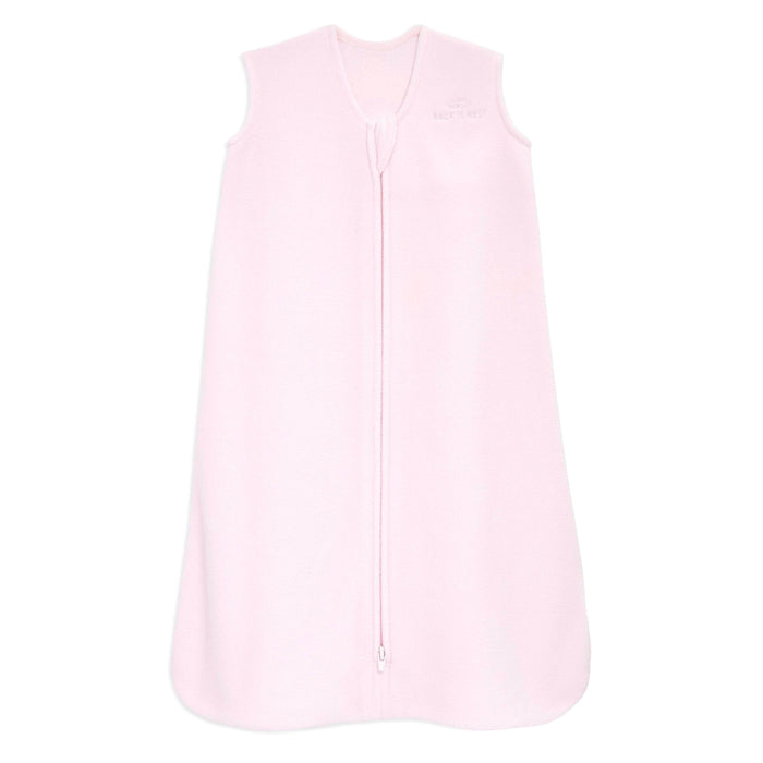 The HALO Wearable Blanket Micro-Fleece TOG 1.0 in light pink is sleeveless and serves as a safe sleep option with front zipper closure, soft fabric, and a small chest logo.