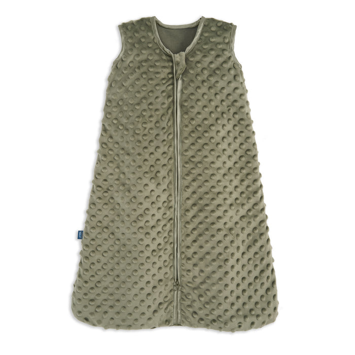 The HALO Wearable Blanket Plushy Dot Velboa TOG 1.5 in olive green features a textured, dimpled fabric, sleeveless design, front zipper from neck to bottom, and a small left-side tag for safe baby sleep.