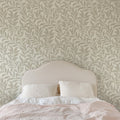 Winding Vines Wallpaper in Beige in a bedroom